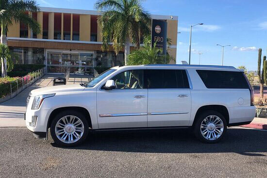 Silver Escalade Luxury SUV at FBO terminal