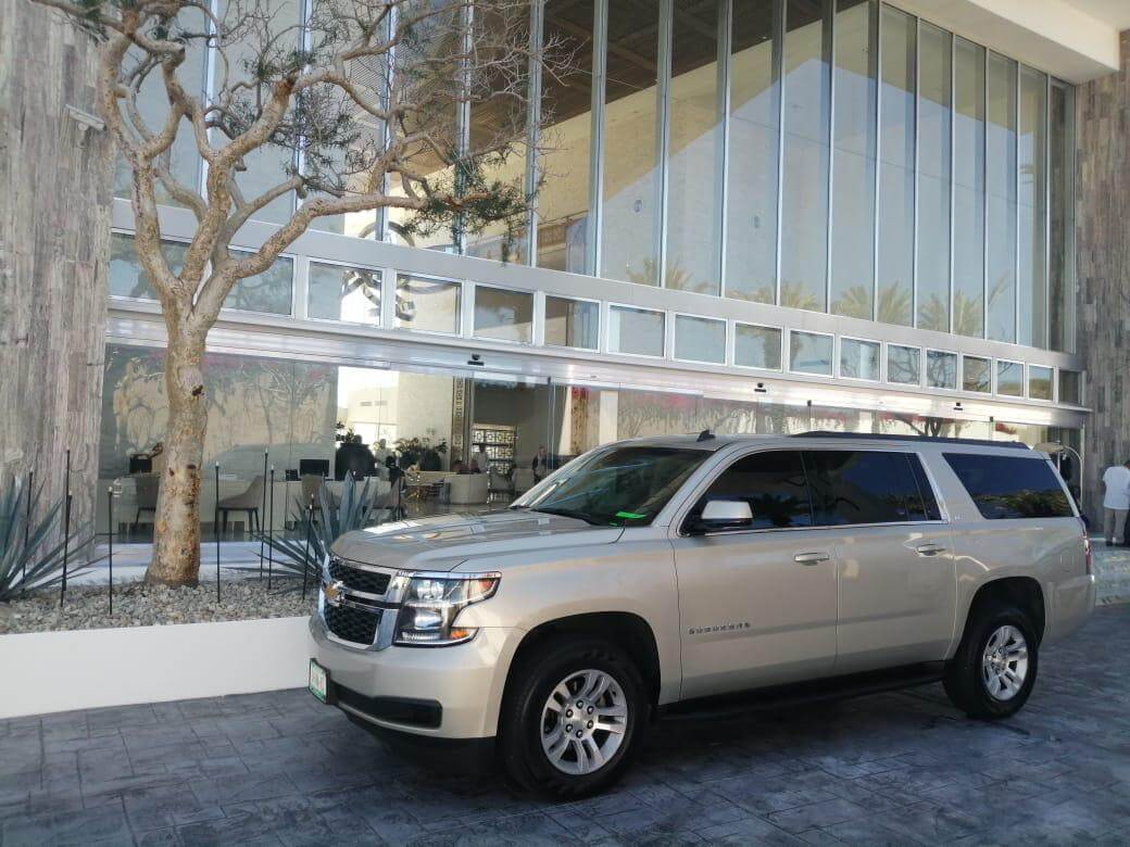 Silver Luxury Suburban at hotel lobby