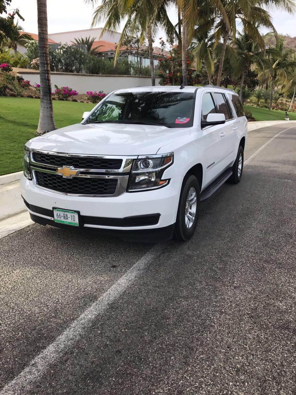 White Surburban Luxury SUV on the road 